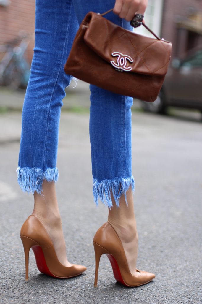 Alexandra Lapp wearing a white shirt from Steffen Schraut, Zara, Christian Louboutin, Chanel, Chanel vintage, BCBG, Chrome Hearts