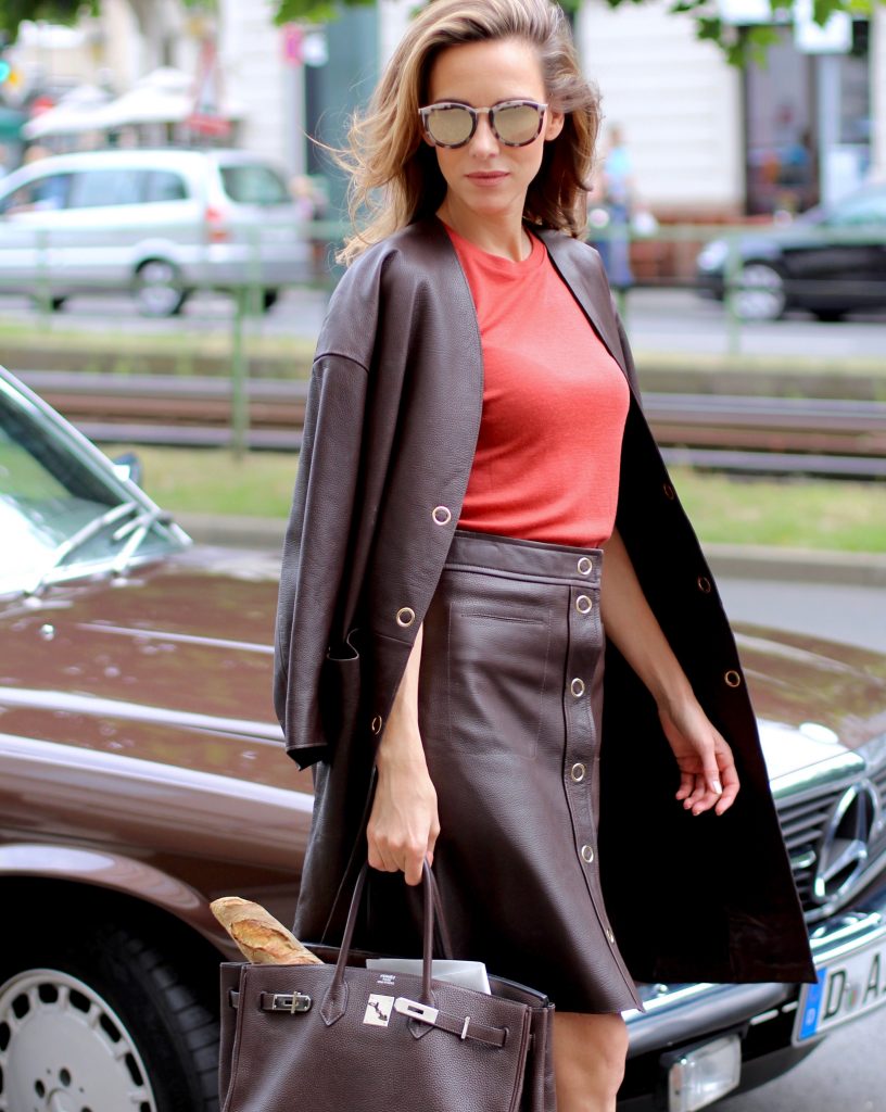 Alexandra Lapp wearing a leather two-piece-suit from Filippa K, Christian Louboutin, Hermès