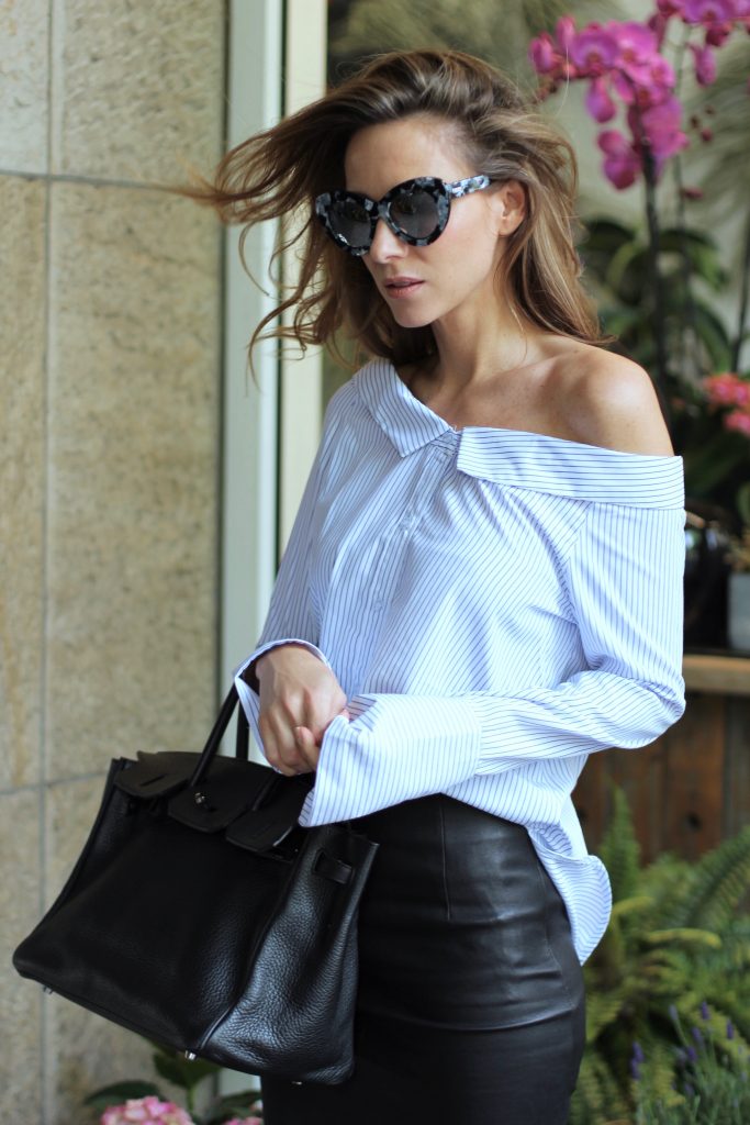 Alexandra lapp wearing off the shoulder blouse from Boutique Belgique, Le Specs, Joseph, Hermès, Saint Laurent