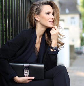 Alexandra Lapp wearing all black, Steffen Schraut, Filippa K., Hermès, Christian Louboutin, IWC