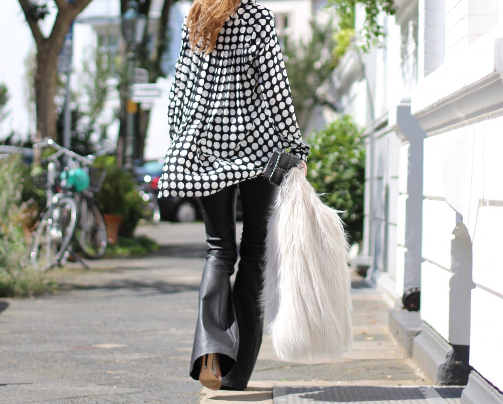 DÜSSELDORF; GERMANY - NOVEMBER : German model and fashion blogger Alexandra Lapp (@alexandralapp_) wearing Polka dots on a blouse from Steffen Schraut, flared leather pants from Tigha, faux fur from Steffen Schraut, Les Specs sunglasses, Gianvito Rossi shoes and Chanel bag on November, 2016 in Germany*** Local Caption *** Alexandra Lapp