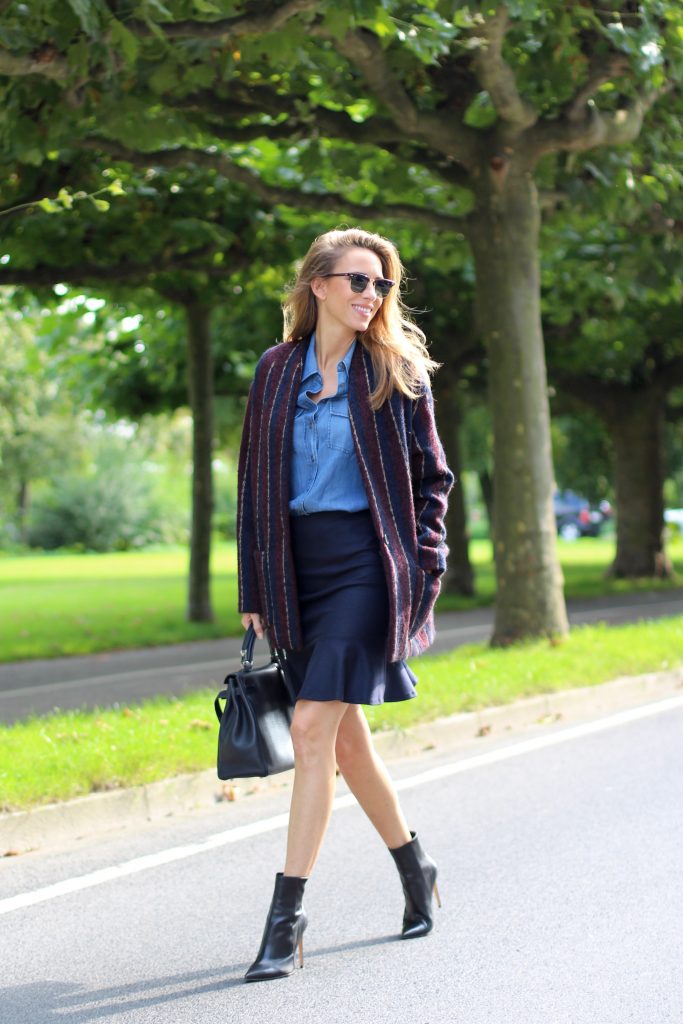 Alexandra Lapp wearing College Set, collage jacket and skirt by SET, Asos denim blouse, Hermès Kelly bag, Ray Ban sunglasses and Gianvito Rossi ankle boots. 