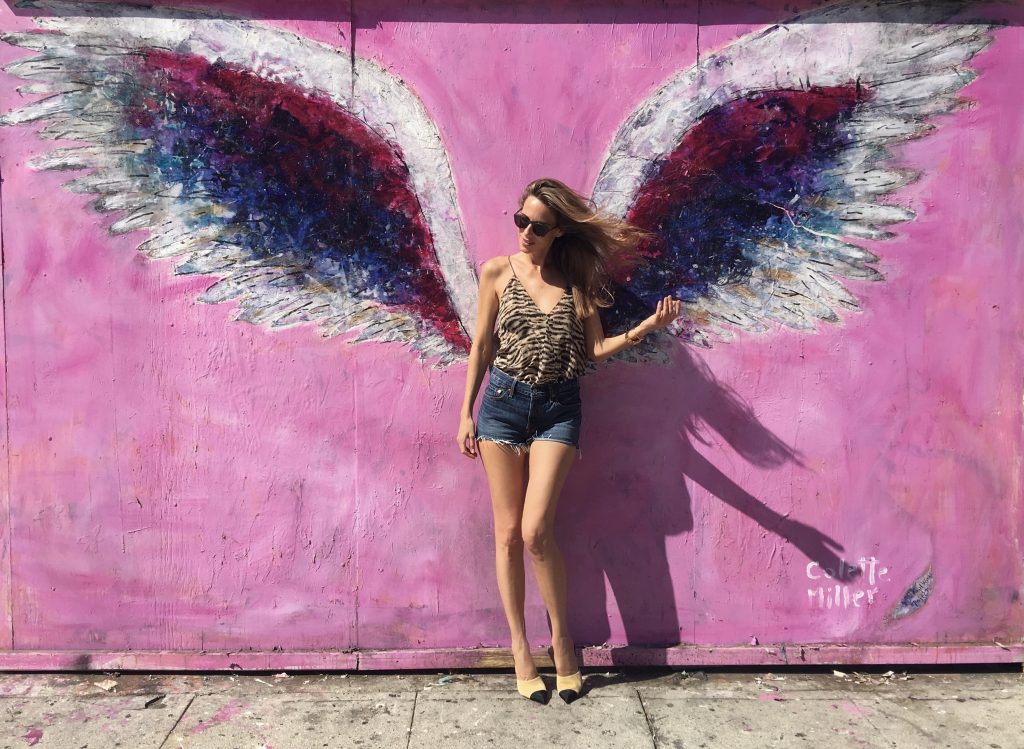 Alexandra Lapp in front of Walls of Los Angeles, The Global Angel Wings Wall.