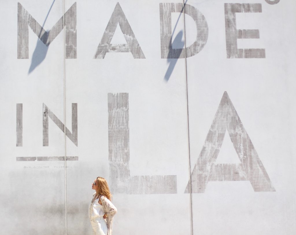 Alexandra Lapp wearing SET, Levi's, Christian Louboutin, Chanel, Chrome Hearts in front of Walls of Los Angeles.