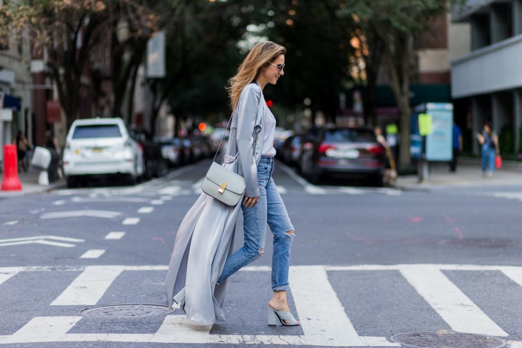 NEW YORK, NY - SEPTEMBER 13: German fashion blogger and model Alexandra Lapp (@alexandralapp_) grey silk trench coat from Galvan, Re Done Levis ripped denim jeans, Gucci mules, Celine bag, Chloe sunglasses on September 13, 2016 in New York City. (Photo by Christian Vierig/Getty Images) *** Local Caption *** Alexandra Lapp