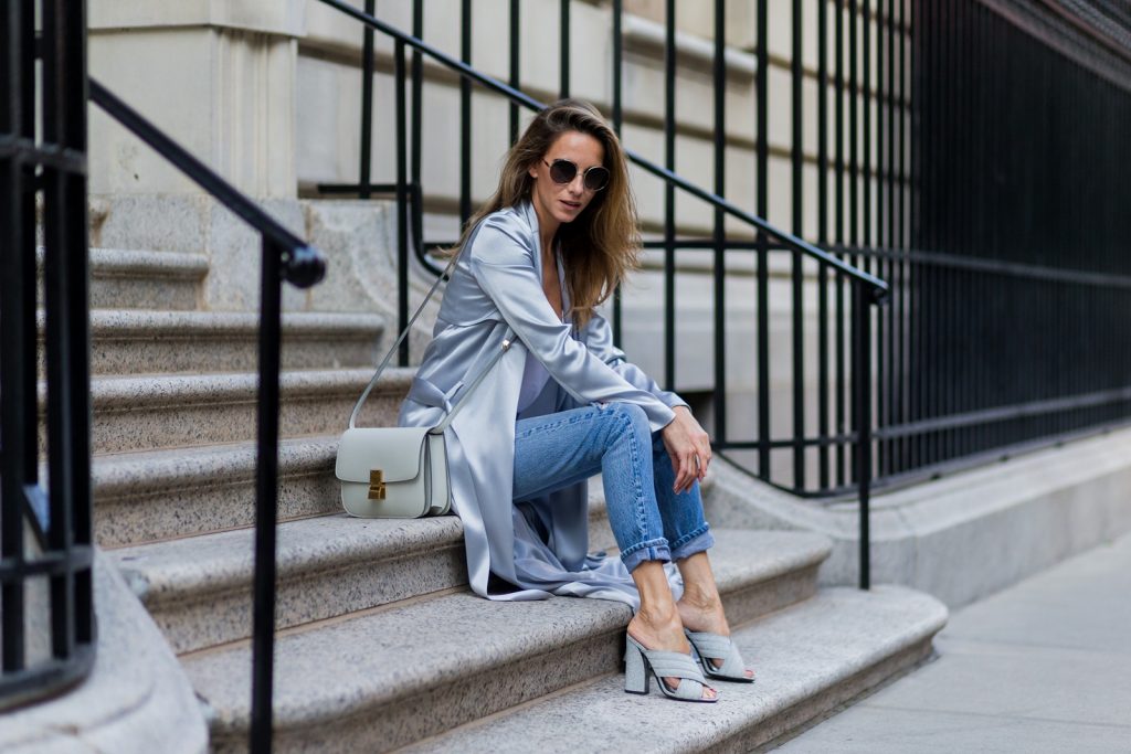 NEW YORK, NY - SEPTEMBER 13: German fashion blogger and model Alexandra Lapp (@alexandralapp_) grey silk trench coat from Galvan, Re Done Levis ripped denim jeans, Gucci mules, Celine bag, Chloe sunglasses on September 13, 2016 in New York City. (Photo by Christian Vierig/Getty Images) *** Local Caption *** Alexandra Lapp