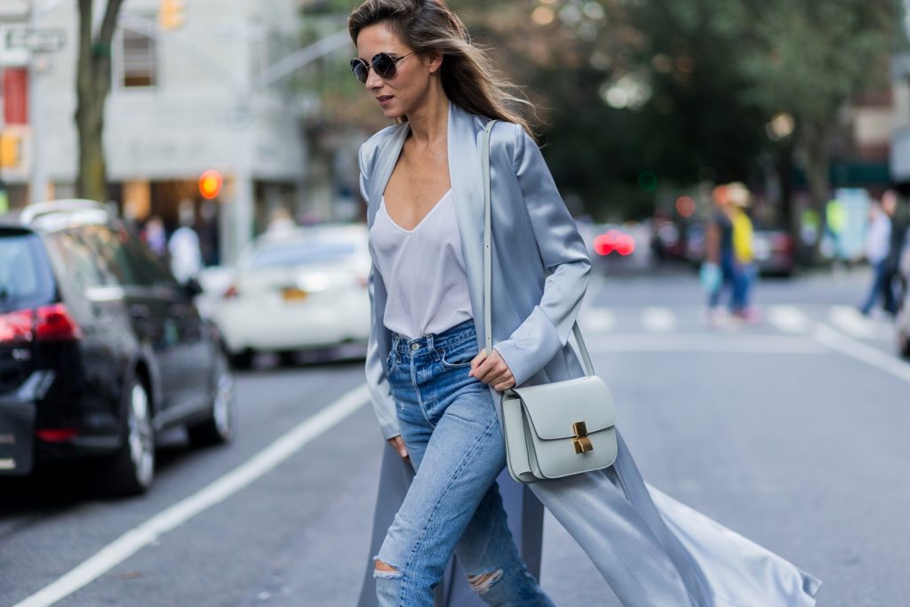 NEW YORK, NY - SEPTEMBER 13: German fashion blogger and model Alexandra Lapp (@alexandralapp_) grey silk trench coat from Galvan, Re Done Levis ripped denim jeans, Celine bag, Chloe sunglasses on September 13, 2016 in New York City. (Photo by Christian Vierig/Getty Images) *** Local Caption *** Alexandra Lapp