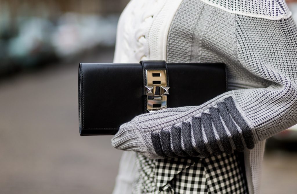 PARIS, FRANCE - OCTOBER 02: German fashion blogger and model Alexandra Lapp (@alexandralapp_) wearing knit wear from Prabal Gurung, skirt and boots from Zara, sunglasses by Le Specs and a clutch from Hermès on October 2, 2016 in Paris, France. (Photo by Christian Vierig/Getty Images) *** Local Caption *** Alexandra Lapp