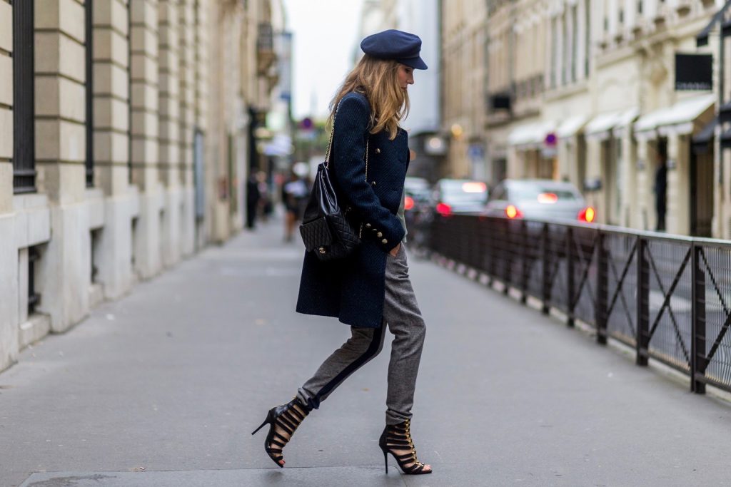 PARIS, FRANCE - SEPTEMBER 30: German fashion blogger and model Alexandra Lapp (@alexandralapp_) wearing Navy Coature, a blouse, grey pants, navy coat and hat from Marc Aurel, strap sandals from Balmain H&M and black Chanel backpack on September 30, 2016 in Paris, France. (Photo by Christian Vierig/Getty Images) *** Local Caption *** Alexandra Lapp