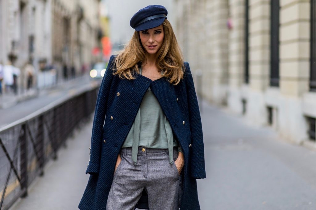 PARIS, FRANCE - SEPTEMBER 30: German fashion blogger and model Alexandra Lapp (@alexandralapp_) wearing Navy Coature, a blouse, grey pants, navy coat and hat from Marc Aurel, strap sandals from Balmain H&M and black Chanel backpack on September 30, 2016 in Paris, France. (Photo by Christian Vierig/Getty Images) *** Local Caption *** Alexandra Lapp