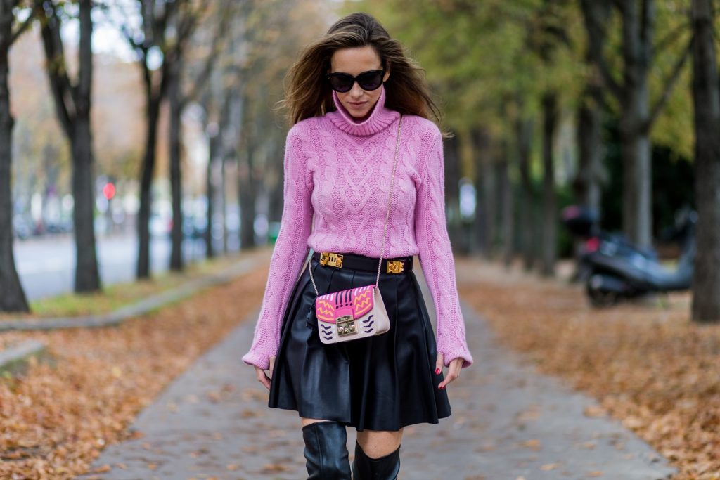 PARIS, FRANCE - OCTOBER 01: German model and fashion blogger Alexandra Lapp (@alexandralapp_) wearing a pink sweater from Jil Sander, leather pleated skirt from Steffen Schraut, overknees from Alaia, Celine sunglasses, Hermes belt, pink Furla bag on October 1, 2016 in Paris, France. (Photo by Christian Vierig/Getty Images) *** Local Caption *** Alexandra Lapp