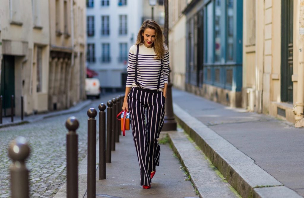 PARIS, FRANCE - OCTOBER 01: German model and fashion blogger Alexandra Lapp (@alexandralapp_) wearing striped jumper from Steffen Schraut, striped pants from Emilio Pucci, suspenders H&M, Gianvito Rossi shoes and Mark Cross bag on October 1, 2016 in Paris, France. (Photo by Christian Vierig/Getty Images) *** Local Caption *** Alexandra Lapp