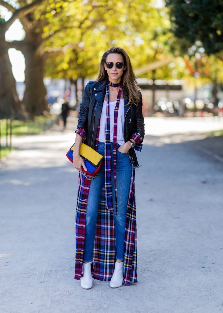 PARIS, FRANCE - OCTOBER 03: German fashion blogger and model Alexandra Lapp (@alexandralapp_) wearing layer love, Levis denim jeans, a white James Perse tshirt, L'Agence plaid dress, white Zara shoes, Ray Ban sunglasses, Schott NYC leather jacket, Chanel bag on October 3, 2016 in Paris, France. (Photo by Christian Vierig/Getty Images) *** Local Caption *** Alexandra Lapp