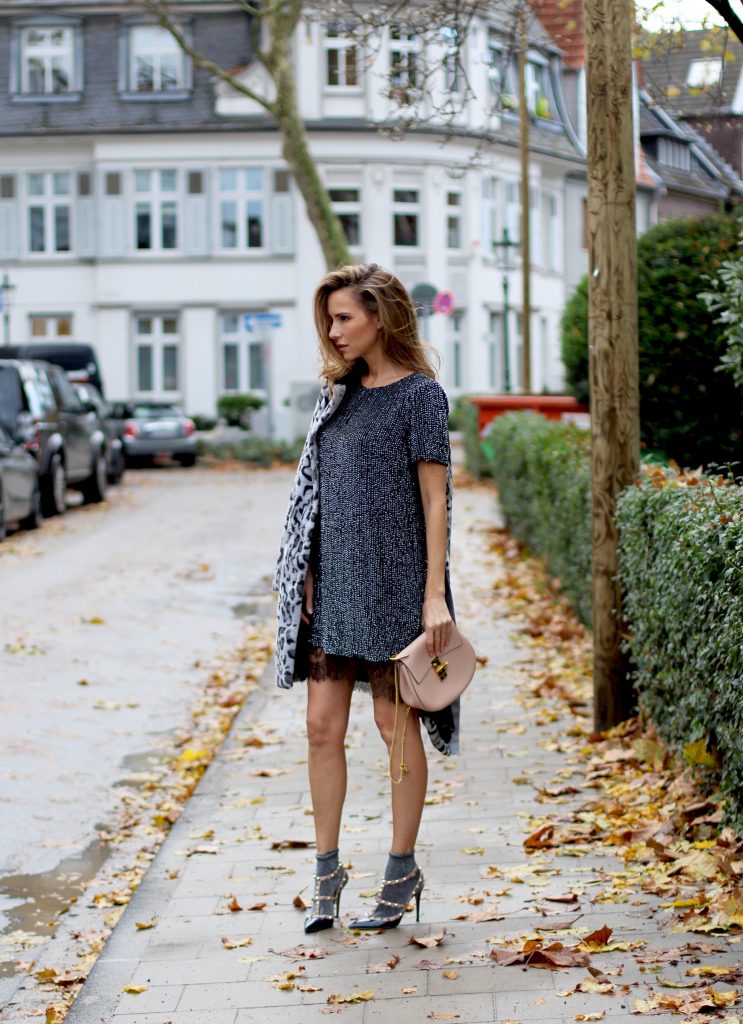 DÜSSELDORF; GERMANY - DEZEMBER : German model and fashion blogger Alexandra Lapp (@alexandralapp_) wearing glitter socks by Forever 21, glitter dress from Marciano Guess, neglige from Agent Provocateur, faux fur, fake fur from Patricia Pepe, rockstud pumps by Valentino and a Chloe bag on Dezember, 2016 in Germany*** Local Caption *** Alexandra Lapp