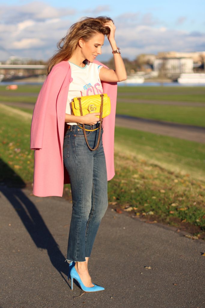 DÜSSELDORF; GERMANY - DEZEMBER : German model and fashion blogger Alexandra Lapp (@alexandralapp_) wearing a Coco Cuba T-shirt from Chanel, high waist denim from Levi's, cashmere coat from Prada, rockstud pumps by Gianvito Rossi and a yellow GG Marmont Mini bag by Gucci on Dezember, 2016 in Germany*** Local Caption *** Alexandra Lapp