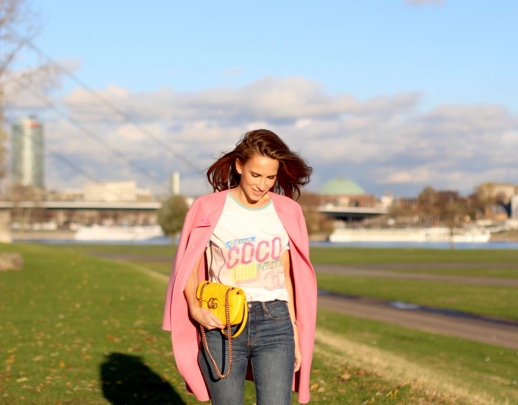 DÜSSELDORF; GERMANY - DEZEMBER : German model and fashion blogger Alexandra Lapp (@alexandralapp_) wearing a Coco Cuba T-shirt from Chanel, high waist denim from Levi's, cashmere coat from Prada, rockstud pumps by Gianvito Rossi and a yellow GG Marmont Mini bag by Gucci on Dezember, 2016 in Germany*** Local Caption *** Alexandra Lapp