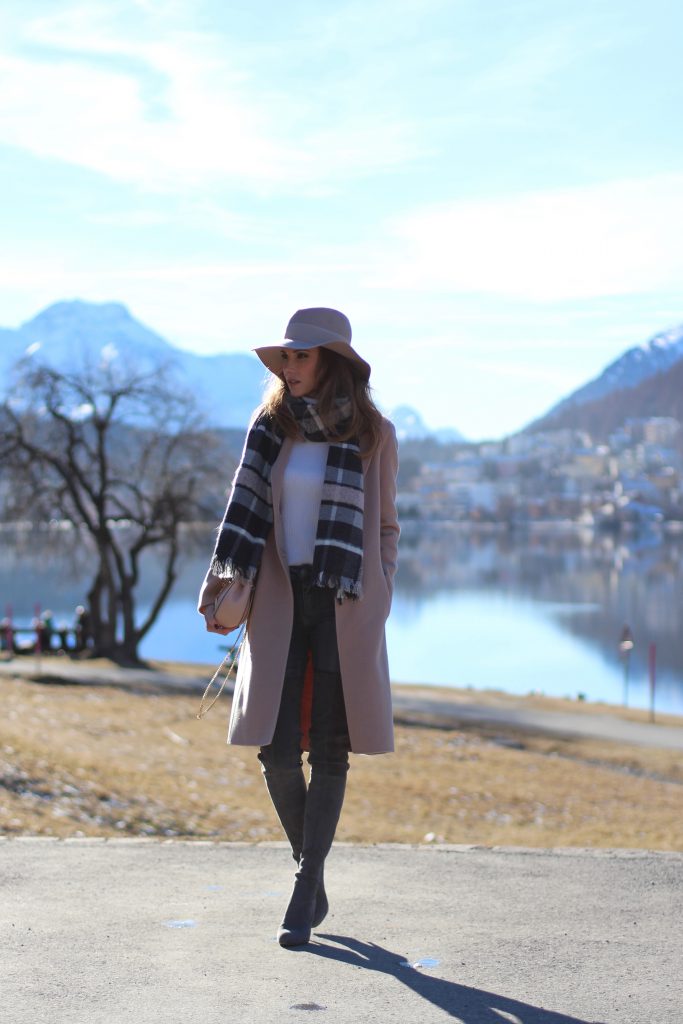 SANKT MORITZ - DEZEMBER : German model and fashion blogger Alexandra Lapp (@alexandralapp_) wearing Marc Cain in St. Moritz, an off white turtleneck, grey slim jeans, a beige cashmere coat, scarf and hat by Marc Cain, overknee boots in grey from Gianvito Rossi, IWC watch and a bag by Chloe on Dezember, 2016 in Sankt Moritz *** Local Caption *** Alexandra Lapp