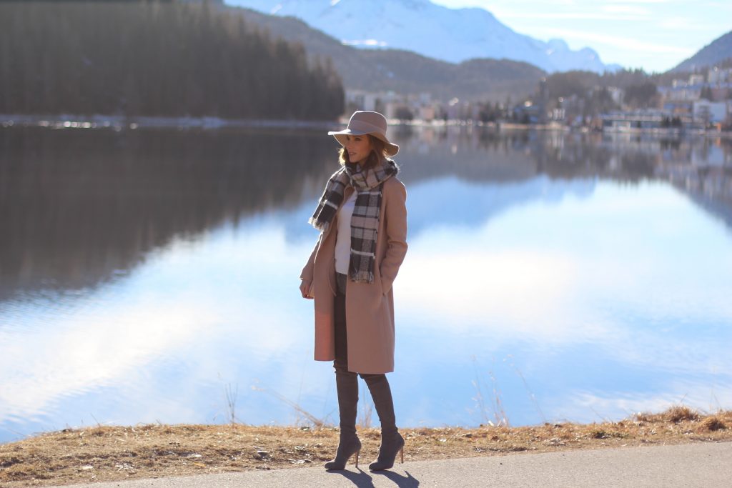 SANKT MORITZ - DEZEMBER : German model and fashion blogger Alexandra Lapp (@alexandralapp_) wearing Marc Cain in St. Moritz, an off white turtleneck, grey slim jeans, a beige cashmere coat, scarf and hat by Marc Cain, overknee boots in grey from Gianvito Rossi, IWC watch and a bag by Chloe on Dezember, 2016 in Sankt Moritz *** Local Caption *** Alexandra Lapp