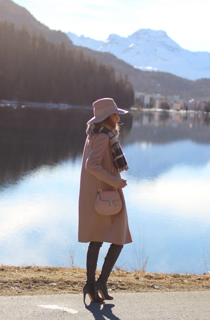 SANKT MORITZ - DEZEMBER : German model and fashion blogger Alexandra Lapp (@alexandralapp_) wearing Marc Cain in St. Moritz, an off white turtleneck, grey slim jeans, a beige cashmere coat, scarf and hat by Marc Cain, overknee boots in grey from Gianvito Rossi, IWC watch and a bag by Chloe on Dezember, 2016 in Sankt Moritz *** Local Caption *** Alexandra Lapp