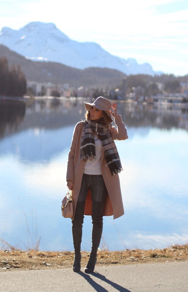 SANKT MORITZ - DEZEMBER : German model and fashion blogger Alexandra Lapp (@alexandralapp_) wearing Marc Cain in St. Moritz, an off white turtleneck, grey slim jeans, a beige cashmere coat, scarf and hat by Marc Cain, overknee boots in grey from Gianvito Rossi, IWC watch and a bag by Chloe on Dezember, 2016 in Sankt Moritz *** Local Caption *** Alexandra Lapp