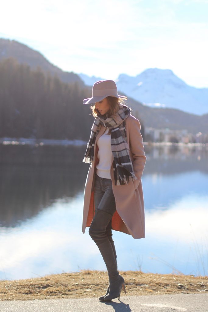 SANKT MORITZ - DEZEMBER : German model and fashion blogger Alexandra Lapp (@alexandralapp_) wearing Marc Cain in St. Moritz, an off white turtleneck, grey slim jeans, a beige cashmere coat, scarf and hat by Marc Cain, overknee boots in grey from Gianvito Rossi, IWC watch and a bag by Chloe on Dezember, 2016 in Sankt Moritz *** Local Caption *** Alexandra Lapp