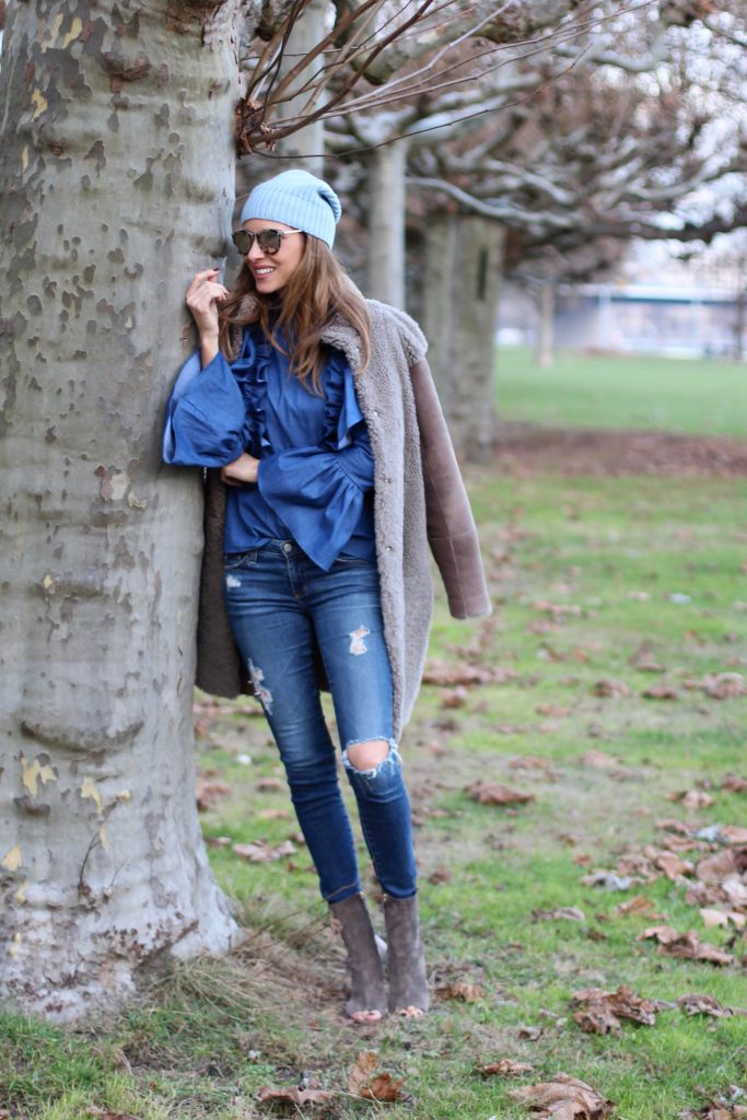 DÜSSELDORF; GERMANY - DEZEMBER : German model and fashion blogger Alexandra Lapp (@alexandralapp_) wearing denim on denim, a denim blouse from Storets, denim by Adriano Goldschmied, velvet booties by Halston, a baby blue beanie from Marc Cain, sunglasses by Le Specs, coat and bag by Steffen Schraut on Dezember, 2016 in Germany*** Local Caption *** Alexandra Lapp
