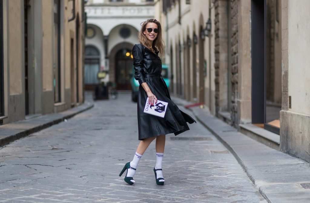 FLORENCE, ITALY - JANUARY 11: German fashion blogger and model Alexandra Lapp, wearing a leather shirt dress from Set Fashion, white tennis socks with printed Mother Fucker, dark green plateau sandals from Prada, Matte black 'Dior So Real' sunglasses from Dior Eyewear and a handmade book clutch from MD Clutch on January 11, 2017 in Florence, Italy. (Photo by Christian Vierig/Getty Images) *** Local Caption *** Alexandra Lapp