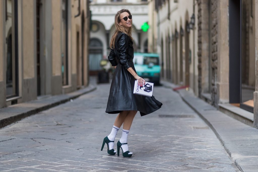 FLORENCE, ITALY - JANUARY 11: German fashion blogger and model Alexandra Lapp, wearing a leather shirt dress from Set Fashion, white tennis socks with printed Mother Fucker, dark green plateau sandals from Prada, Matte black 'Dior So Real' sunglasses from Dior Eyewear and a handmade book clutch from MD Clutch on January 11, 2017 in Florence, Italy. (Photo by Christian Vierig/Getty Images) *** Local Caption *** Alexandra Lapp