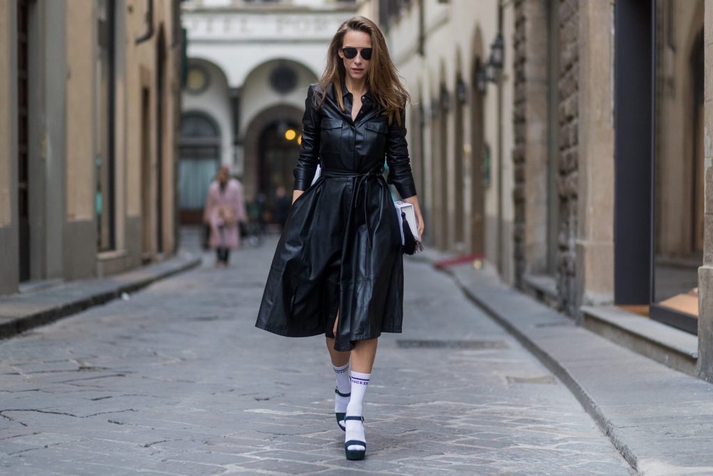 FLORENCE, ITALY - JANUARY 11: German fashion blogger and model Alexandra Lapp, wearing a leather shirt dress from Set Fashion, white tennis socks with printed Mother Fucker, dark green plateau sandals from Prada, Matte black 'Dior So Real' sunglasses from Dior Eyewear and a handmade book clutch from MD Clutch on January 11, 2017 in Florence, Italy. (Photo by Christian Vierig/Getty Images) *** Local Caption *** Alexandra Lapp