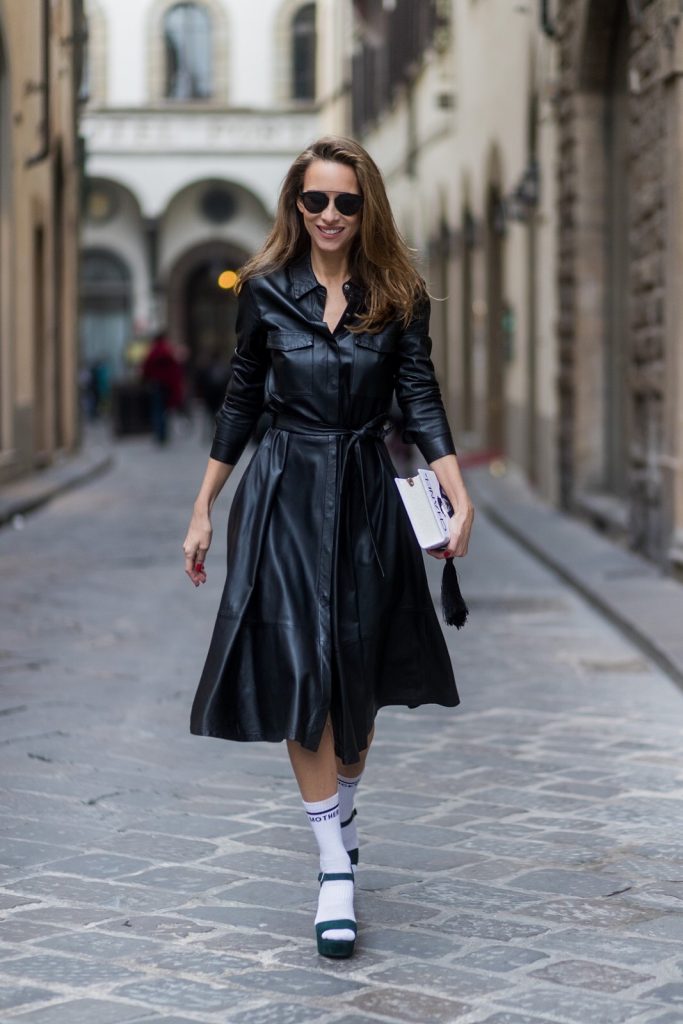 FLORENCE, ITALY - JANUARY 11: German fashion blogger and model Alexandra Lapp, wearing a leather shirt dress from Set Fashion, white tennis socks with printed Mother Fucker, dark green plateau sandals from Prada, Matte black 'Dior So Real' sunglasses from Dior Eyewear and a handmade book clutch from MD Clutch on January 11, 2017 in Florence, Italy. (Photo by Christian Vierig/Getty Images) *** Local Caption *** Alexandra Lapp