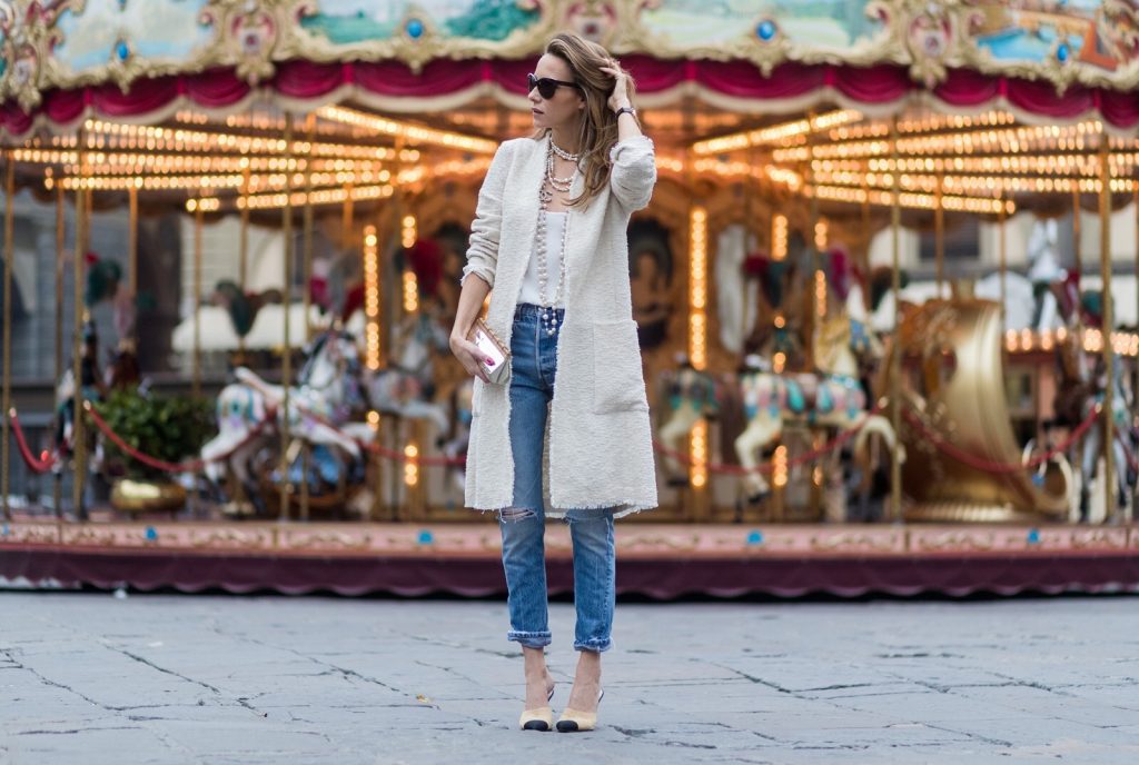 FLORENCE, ITALY - JANUARY 11: German fashion blogger and model Alexandra Lapp, wearing a Levi's RE/DONE jeans, a tank top by Jadicted, a white, classic coat from Oui Fashion, white pearls and sunglasses with pearls from Chanel and Chanel mules and clutch on January 11, 2017 in Florence, Italy. (Photo by Christian Vierig/Getty Images) *** Local Caption *** Alexandra Lapp