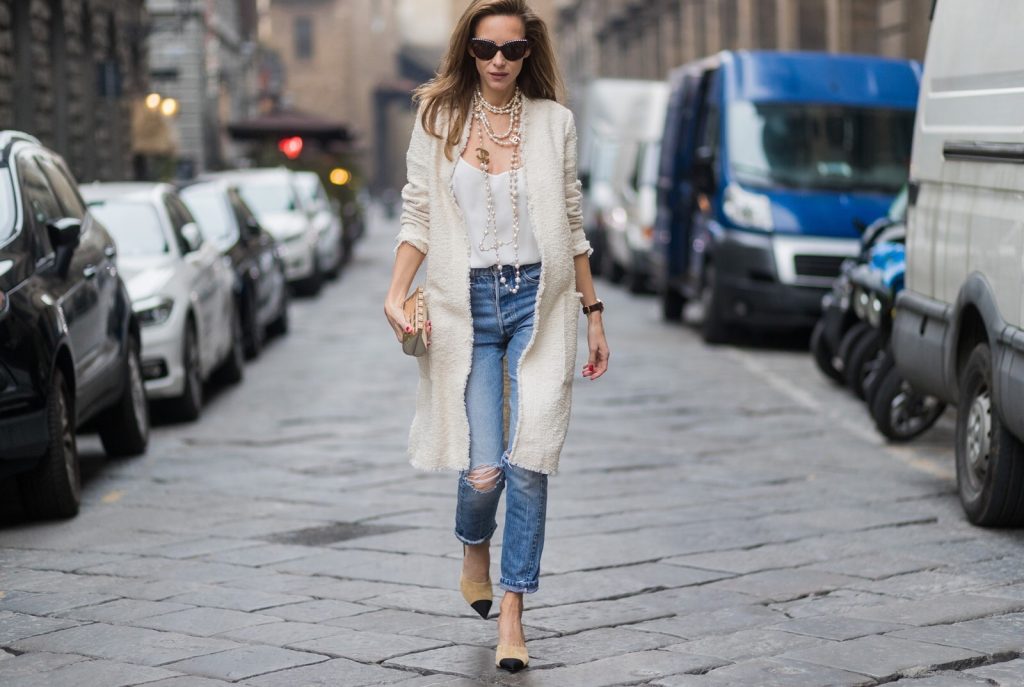 FLORENCE, ITALY - JANUARY 11: German fashion blogger and model Alexandra Lapp, wearing a Levi's RE/DONE jeans, a tank top by Jadicted, a white, classic coat from Oui Fashion, white pearls and sunglasses with pearls from Chanel and Chanel mules and clutch on January 11, 2017 in Florence, Italy. (Photo by Christian Vierig/Getty Images) *** Local Caption *** Alexandra Lapp