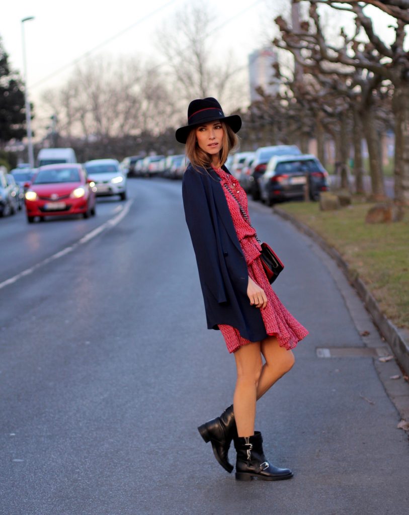 DÜSSELDORF, GERMANY - FEBRUARY 19: German fashion blogger and model Alexandra Lapp is wearing a flounce dress in red from Steffen Schraut, a midnight blue blazer by Steffen Schraut, Maison Michel Virginie rabbit-felt fedora hat in black with a grosgrain ribbon in dark blue with red, that is adorned with the label's logo in the form of a glossy black charm, a boy bag in black and red calfskin and vintage biker boots by Gucci on February 19, 2017 Düsseldorf, Germany. *** Local Caption *** Alexandra Lapp