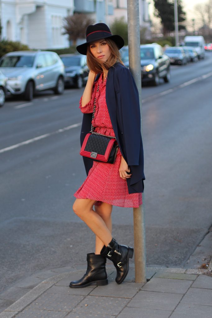 DÜSSELDORF, GERMANY - FEBRUARY 19: German fashion blogger and model Alexandra Lapp is wearing a flounce dress in red from Steffen Schraut, a midnight blue blazer by Steffen Schraut, Maison Michel Virginie rabbit-felt fedora hat in black with a grosgrain ribbon in dark blue with red, that is adorned with the label's logo in the form of a glossy black charm, a boy bag in black and red calfskin and vintage biker boots by Gucci on February 19, 2017 Düsseldorf, Germany. *** Local Caption *** Alexandra Lapp