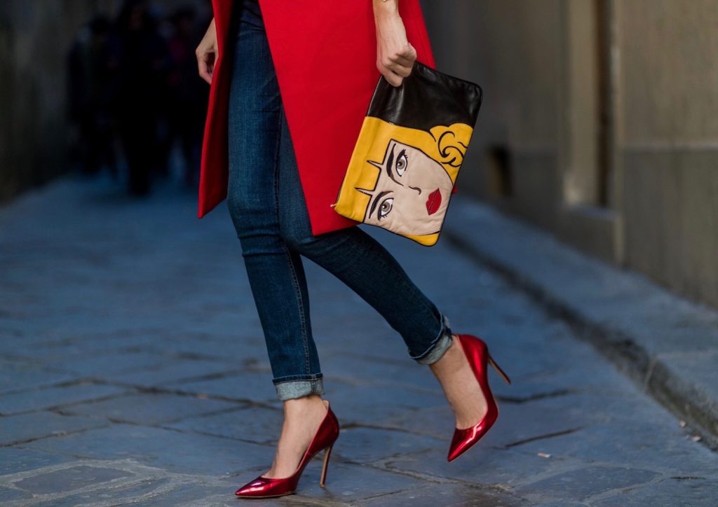 FLORENCE, ITALY - JANUARY 11: German fashion blogger and model Alexandra Lapp is wearing red blazer coat from Oui Fashion, pink silk top from Jadicted, high waist jeans/denim from Rag & Bone, red metallic pumps from Gianvito Rossi, Prada clutch, leather belt from SET on January 11, 2017 in Florence, Italy. (Photo by Christian Vierig/Getty Images) *** Local Caption *** Alexandra Lapp