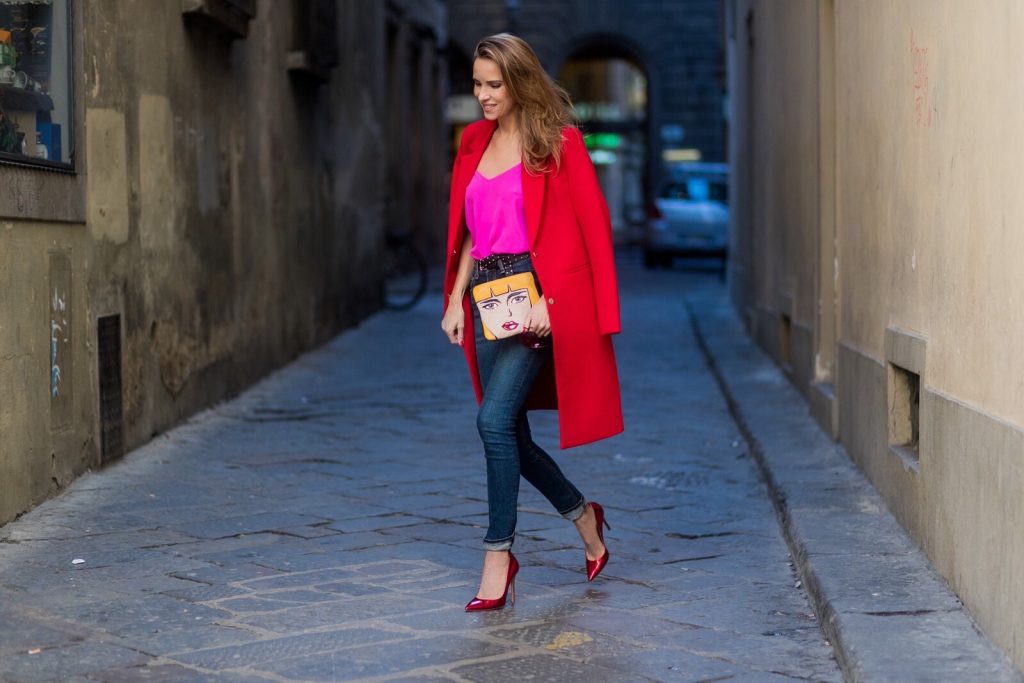 FLORENCE, ITALY - JANUARY 11: German fashion blogger and model Alexandra Lapp is wearing red blazer coat from Oui Fashion, pink silk top from Jadicted, high waist jeans/denim from Rag & Bone, red metallic pumps from Gianvito Rossi, Prada clutch, leather belt from SET on January 11, 2017 in Florence, Italy. (Photo by Christian Vierig/Getty Images) *** Local Caption *** Alexandra Lapp