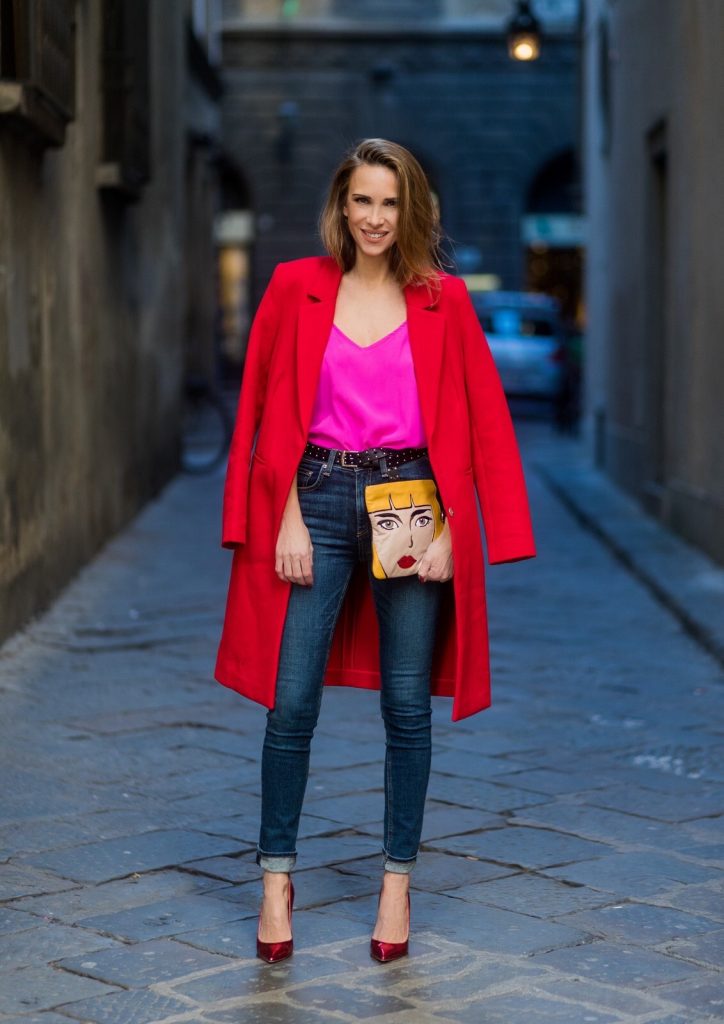 FLORENCE, ITALY - JANUARY 11: German fashion blogger and model Alexandra Lapp is wearing red blazer coat from Oui Fashion, pink silk top from Jadicted, high waist jeans/denim from Rag & Bone, red metallic pumps from Gianvito Rossi, Prada clutch, leather belt from SET on January 11, 2017 in Florence, Italy. (Photo by Christian Vierig/Getty Images) *** Local Caption *** Alexandra Lapp