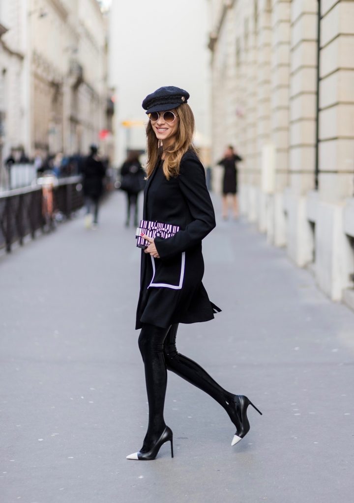 PARIS; FRANCE; RUE CAMBON; Model and Blogger Alexandra Lapp wearing black Couture Latex socks from Atsuko Kudo, coat from Steffen Schraut, Pumps by Saint Laurent, Cap from Chanel, Chanel Lego Brique (brick) bag in black and white, Sunglasses by Chromehearts on March 3, 2017 in Paris, France.