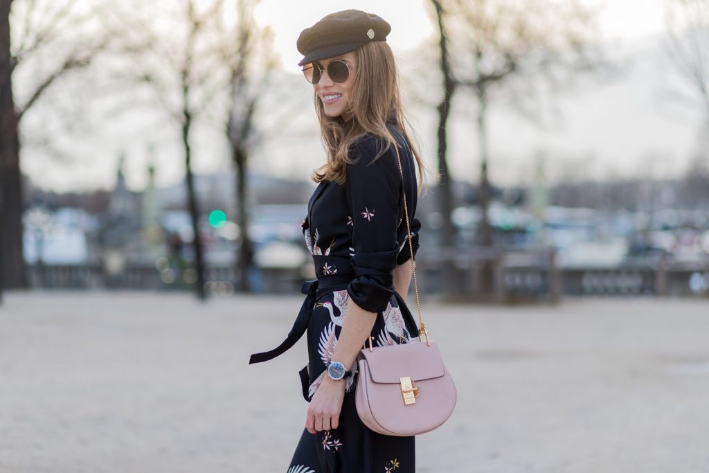 PARIS; FRANCE; during PFW, Model and Blogger Alexandra Lapp wearing Sleepwear to Daywear, Printed jacket with contrasting sash belt, lapel collar and long sleeves from Zara in black with rose birds, Matching flowing printed culottes from Zara in black with rose birds, Christian Louboutin nude lacquer pumps, nude Drew small leather cross-body bag by Chloe, Cap from Chanel, Sunglasses by Chloe on March 3, 2017 in Paris, France.