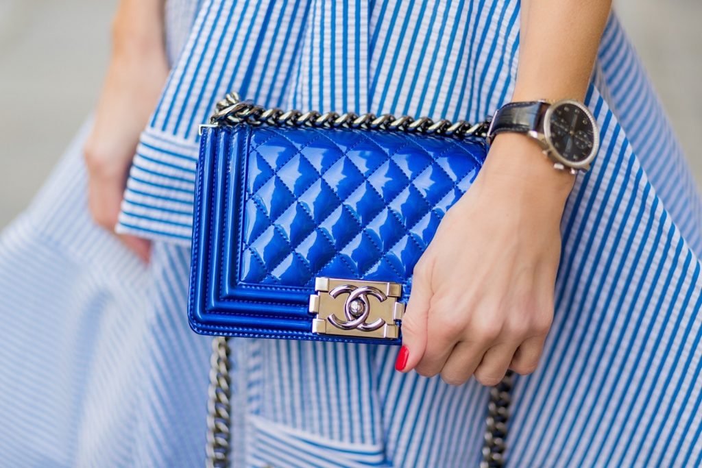 PARIS; FRANCE; Model and Blogger Alexandra Lapp wearing a striped shirt dress, a long dress made of stripe stretch seersucker in greek blue and white from Talbot Runhof, blue plexi pumps from Gianvito Rossi and a blue Boy bag from Chanel on March 3, 2017 in Paris, France.