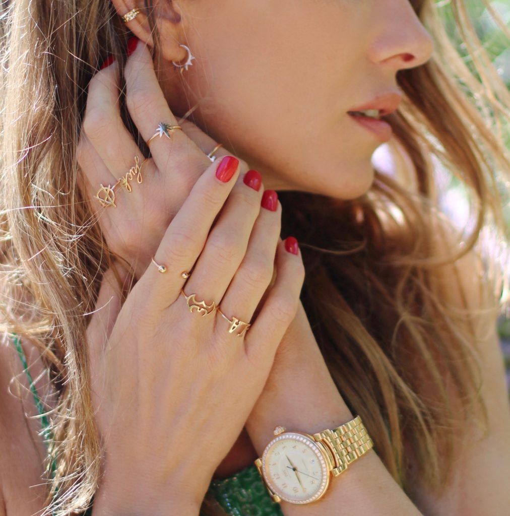 Los Angeles, MALIBU, April 2017, Model and Blogger Alexandra Lapp wearing Art Youth Society AYS jewelry, a green long JOY dress by Stella McCartney, bracelets from GAS Bijoux, a coin belt around the neck worn like a necklace and a IWC Da Vinci watch in red gold with diamonds in Malibu, Los Angeles, April 2017.