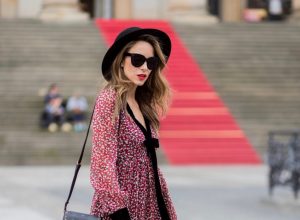 Alexandra Lapp wearing Boho Style, a red and cream floral print maxi dress from Philosophy di Lorenzo Serafini in sheer silk chiffon and bold black trims with a ribbon tie, Toubootfrou ankle boots with rete, organze and suede in black from Christian Louboutin, Celine Audrey sunglasses in black, Maison Maison Michel hat Virginie fedora, MCM Patricia Shoulder Bag in a vintage shape during the Mercedes-Benz Fashion Week Berlin Spring/Summer 2018 on July 7, 2017 in Berlin, Germany. Alexandra Lapp wearing Boho Style, a red and cream floral print maxi dress from Philosophy di Lorenzo Serafini in sheer silk chiffon and bold black trims with a ribbon tie, Toubootfrou ankle boots with rete, organze and suede in black from Christian Louboutin, Celine Audrey sunglasses in black, Maison Maison Michel hat Virginie fedora, MCM Patricia Shoulder Bag in a vintage shape during the Mercedes-Benz Fashion Week Berlin Spring/Summer 2018 on July 7, 2017 in Berlin, Germany.