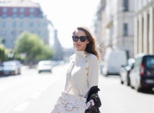 Model and fashion blogger Alexandra Lapp wearing white leather tassel mules from Santoni. a off white cashmere pullover by Heartbreaker, Kimono with velvet collar from Zara, Adriano Goldschmied AG jeans, Roger Viv bag in suede with waterjet cut Guipure detailing, metal buckle and details, removable strap in trapezium shape, silver mirrored sunglasses from Le Spec during the Mercedes-Benz Fashion Week Berlin Spring/Summer 2018 on July 8, 2017 in Berlin, Germany.