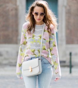 Cashmere love for Model and fashion blogger Alexandra Lapp, who is wearing colorful cashmere pullover by Heartbreaker, high waist five-pocket 501 skinny jeans from Levis, cashmere scarf in grey by Heartbreaker, white snake pumps from Christian Louboutin, round sunglasses in white from Chrome Hearts, Celine Box bag in light grey and a big statement ring in rose gold with baguette diamonds by Schubart Goldschmiede on August 5, 2017 in Duesseldorf, Germany.