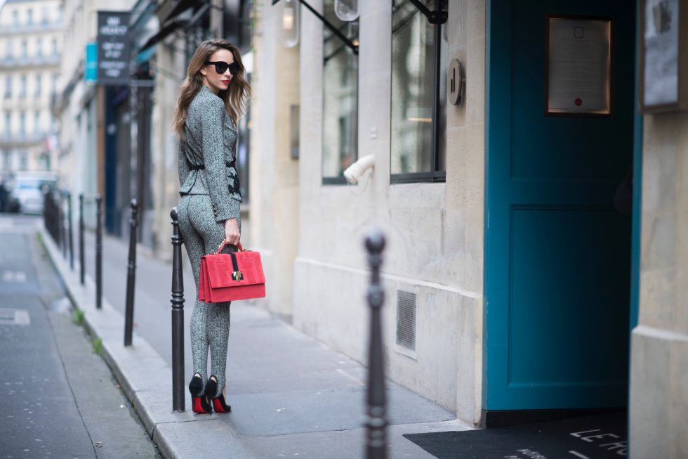 Alexandra Lapp seen wearing stirrup pants and blazer in checkered pattern, glencheck and a red bag by Marc Cain, So Kate pumps from Christian Louboutin, Celine Audrey sunglasses and a waist belt by Hermes in the streets of Paris on September 27, 2017 in Paris, France.
