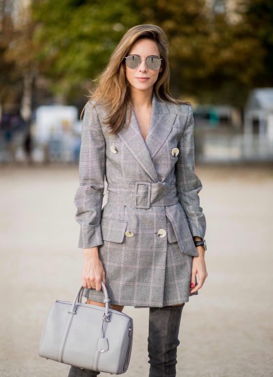 Alexandra Lapp wearing plaid blazer dress with a waist belt from Zara, the Essential Boston Bag with Monogramm in grey by MCM, silver mirrored sunglasses from le Specs, grey suede overknee boots by Gianvito Rossi is seen during Paris Fashion Week Spring/Summer 2018 on September 28, 2017 in Paris, France.
