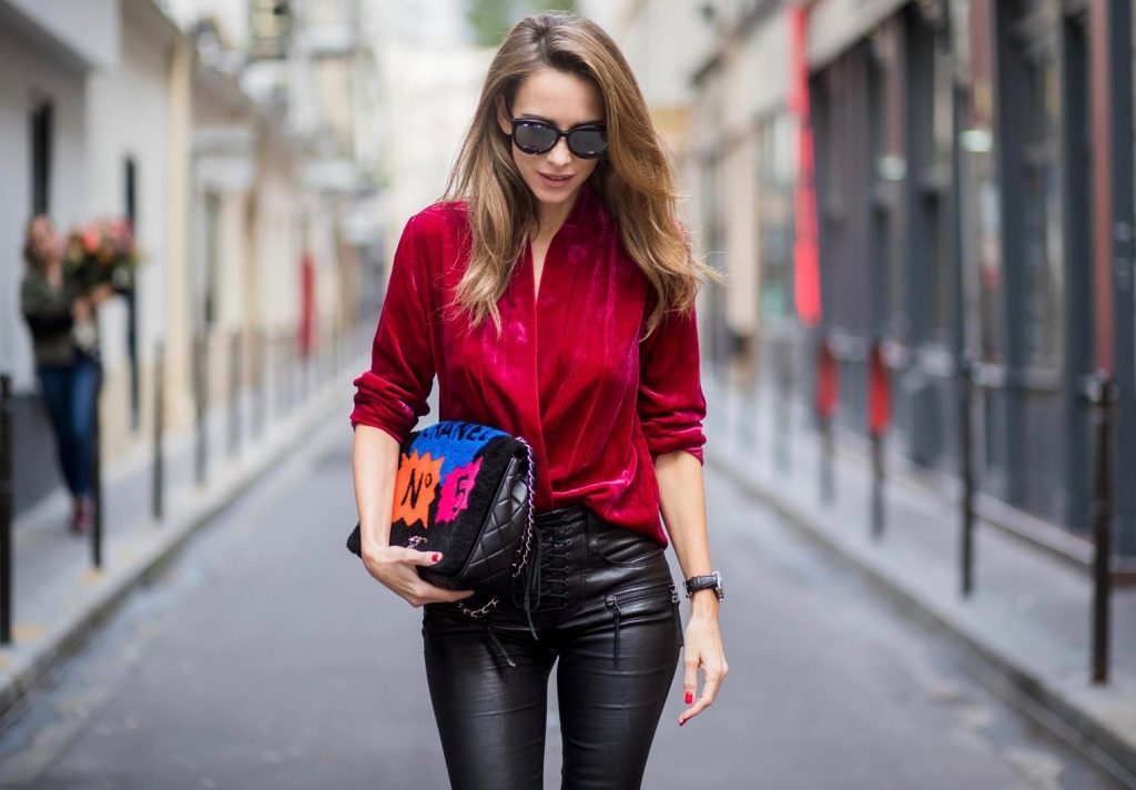 Alexandra Lapp having a velvet crush, wearing a velvet blazer from Jadicted in burgundy red, leather pants in black with laced high waist and ankle zippers from Unravel, Chanel lambskin bag printed with Chanel No.5 from the supermarket collection by Chanel, Diormania sunglasses by Dior, Opyum 110 lacquer ankle boots from Saint Laurent, and mother fucker socks from Mother Denim is seen during Paris Fashion Week Spring/Summer 2018 on September 29, 2017 in Paris, France.