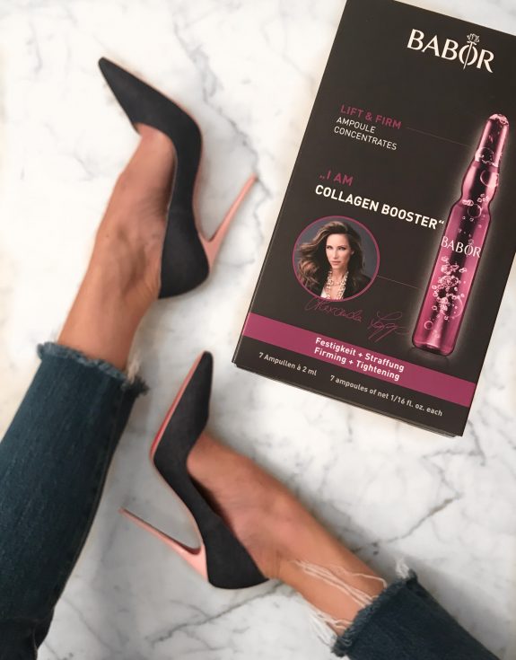 Alexandra Lapp says - I am Collagen Booster, holding the new Babor Ampoules in her hands while wearing Christian Louboutin denim heels.