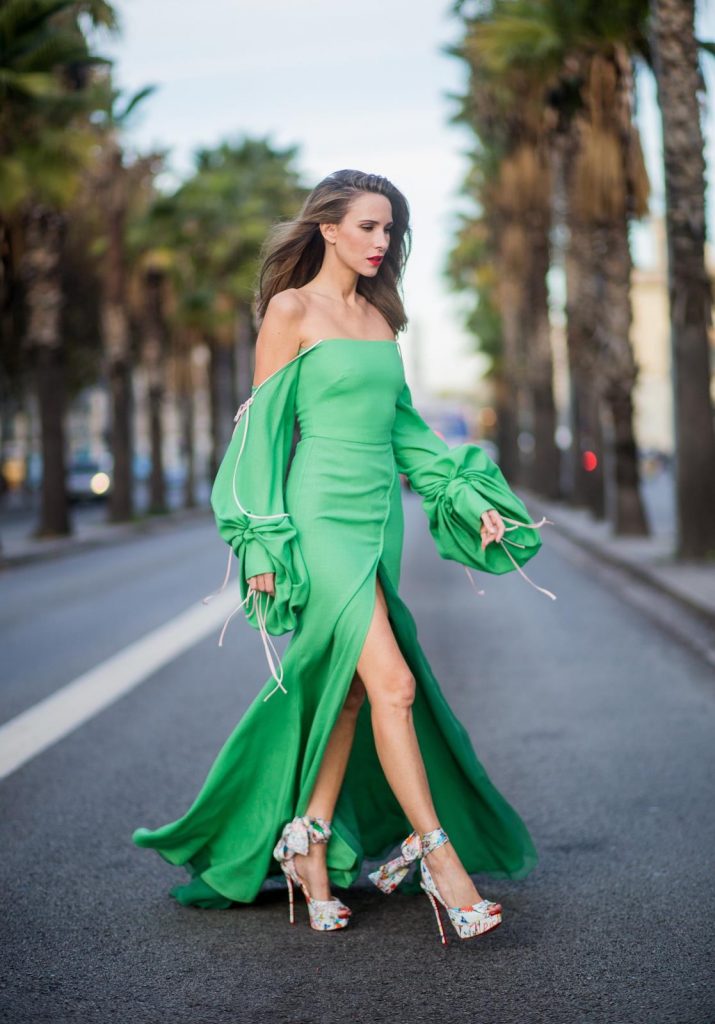 BARCELONA, SPAIN - NOVEMBER 27: Hawaiin vibes in Barcelona, Alexandra Lapp wearing a green long dress from Lana Mueller and Christian Louboutin multicolor heels on November 27, 2017 in Barcelona, Spain. 