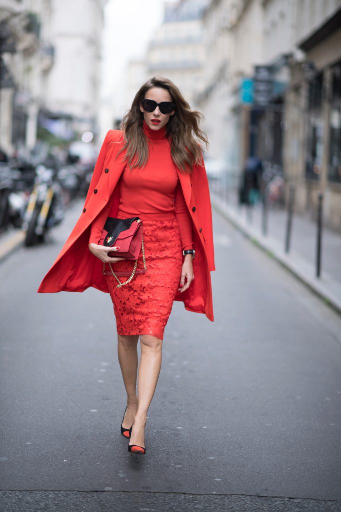 Alexandra Lapp seen wearing an orange outfit from Marc Cain, Manolo Blahnik heels in black with orange and Céline Audrey sunglasses, in the streets of Paris on September 27, 2017 in Paris, France.